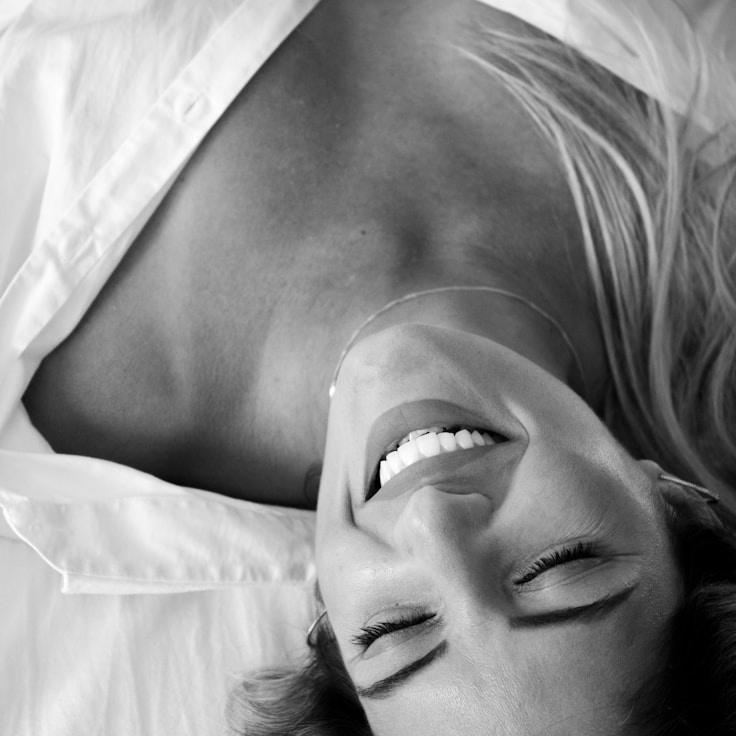 Asha Malik, Lead Design Curator at Atlas Silver Grove, reviewing corporate floral arrangements